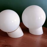 Two opaline glass globe wall lights