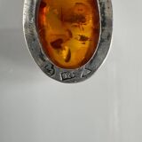 Silver spoon with amber