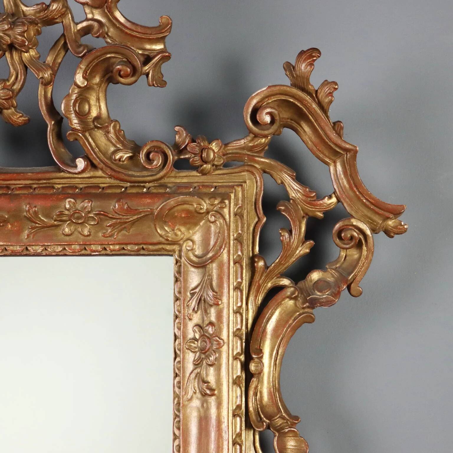Antique carved and gilded wooden mirror, Italy, early 20th century.