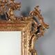 Antique carved and gilded wooden mirror, Italy, early 20th century.