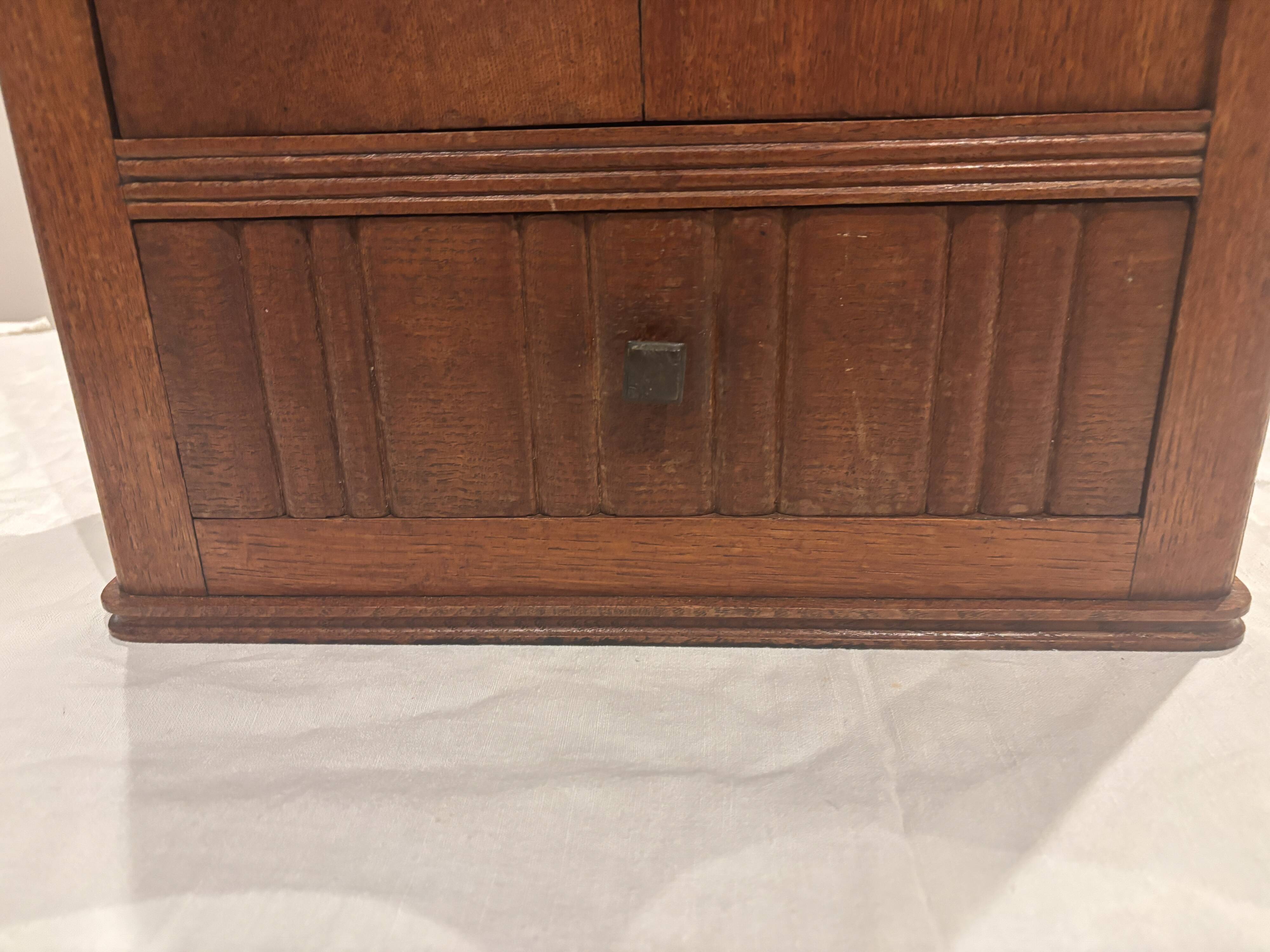 Wall cabinet with oval wall and drawer