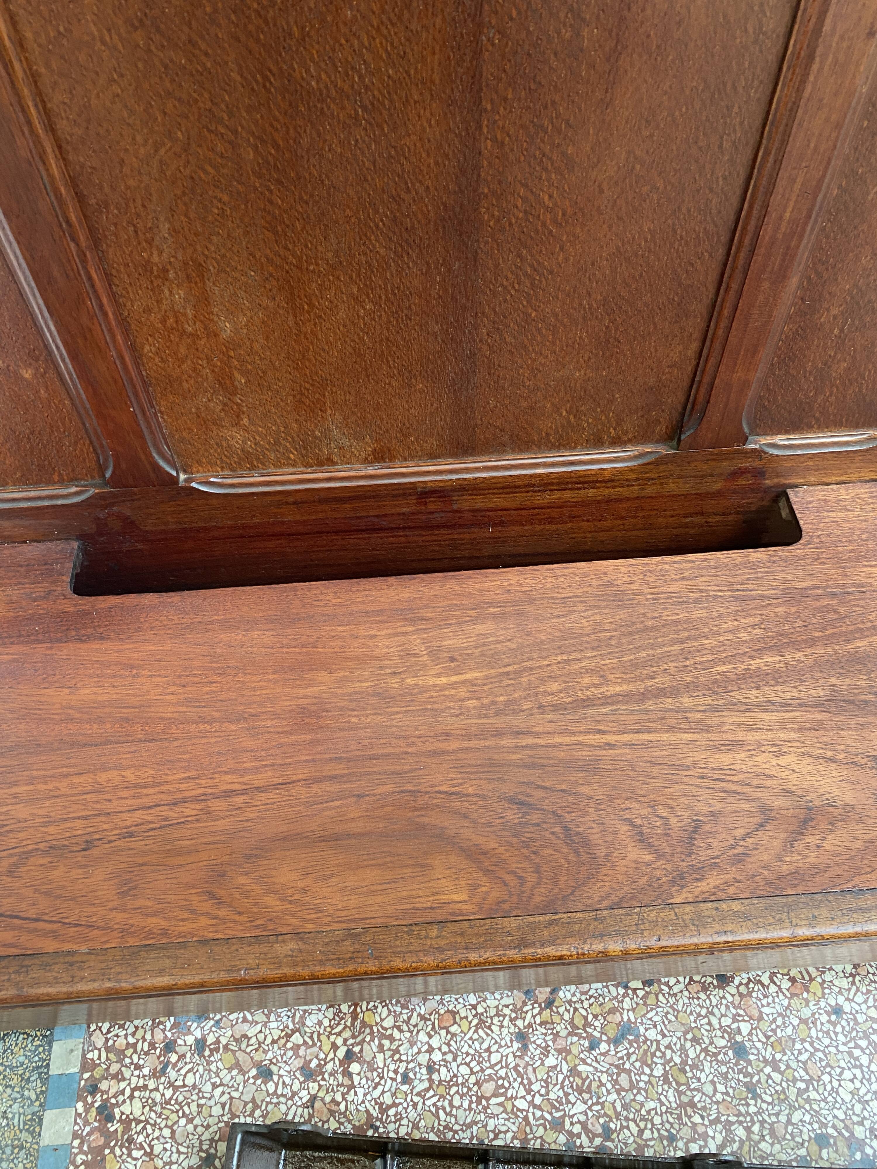 Antique wooden coat rack with mirror and shelf.