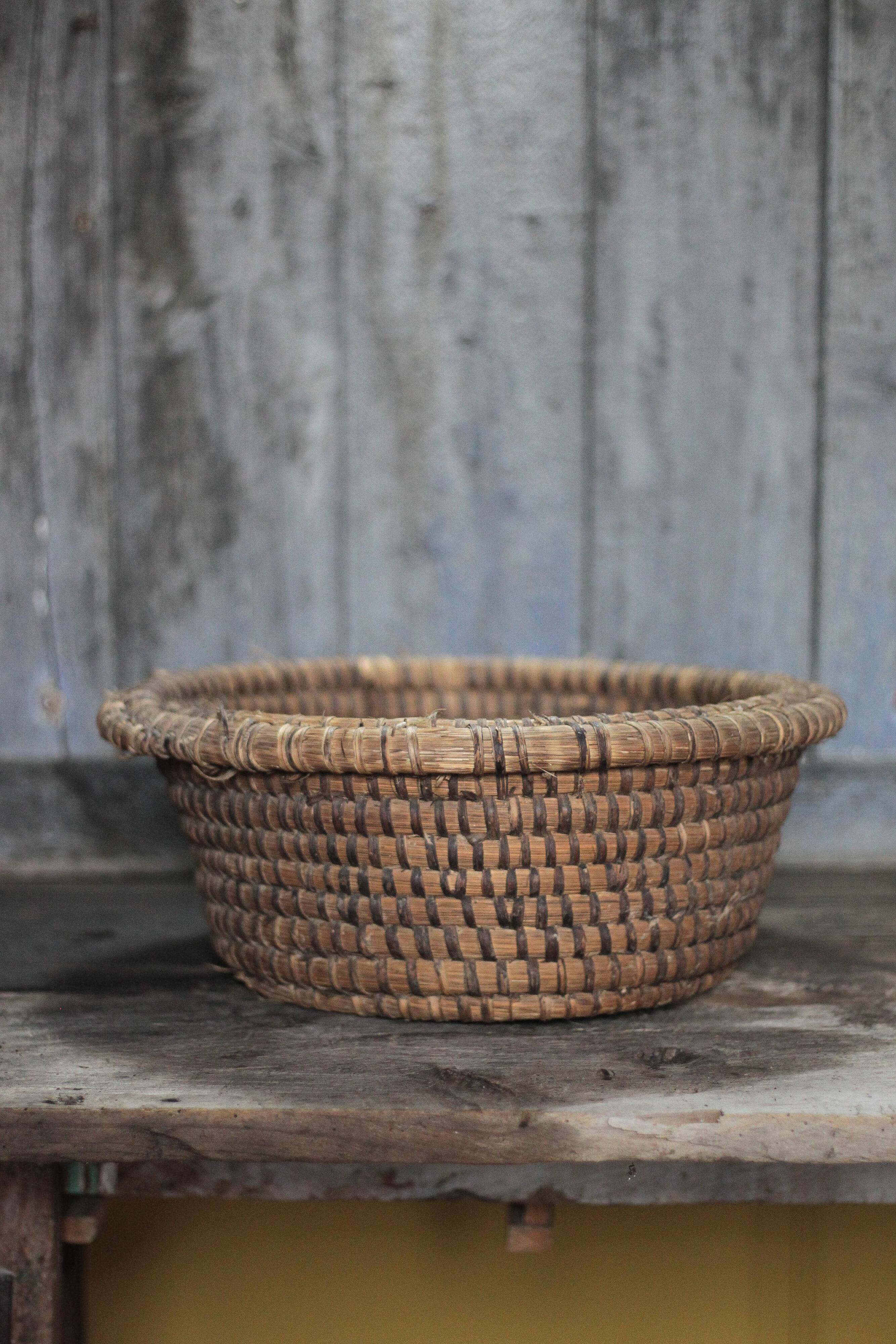 Old wicker basket, straw and bramble, woven basket, countryside.