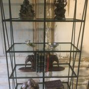 Pair of wrought iron and glass bookshelf shelves.