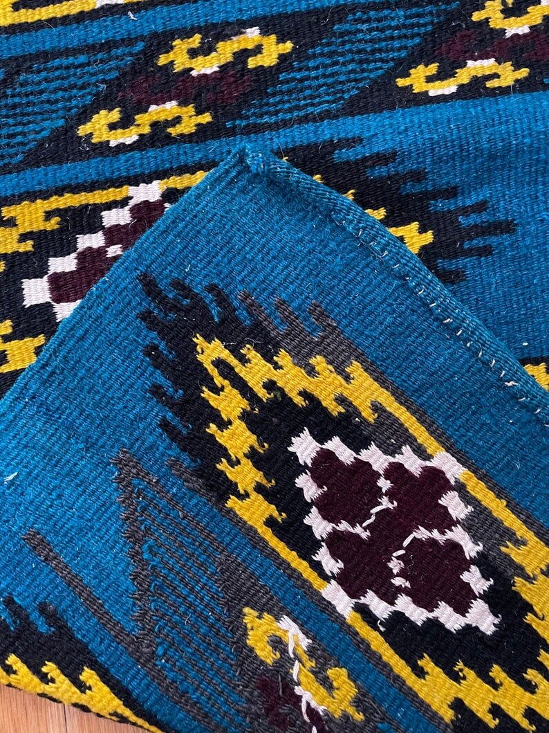 Romanian handwoven carpet with blue ground and yellow details
