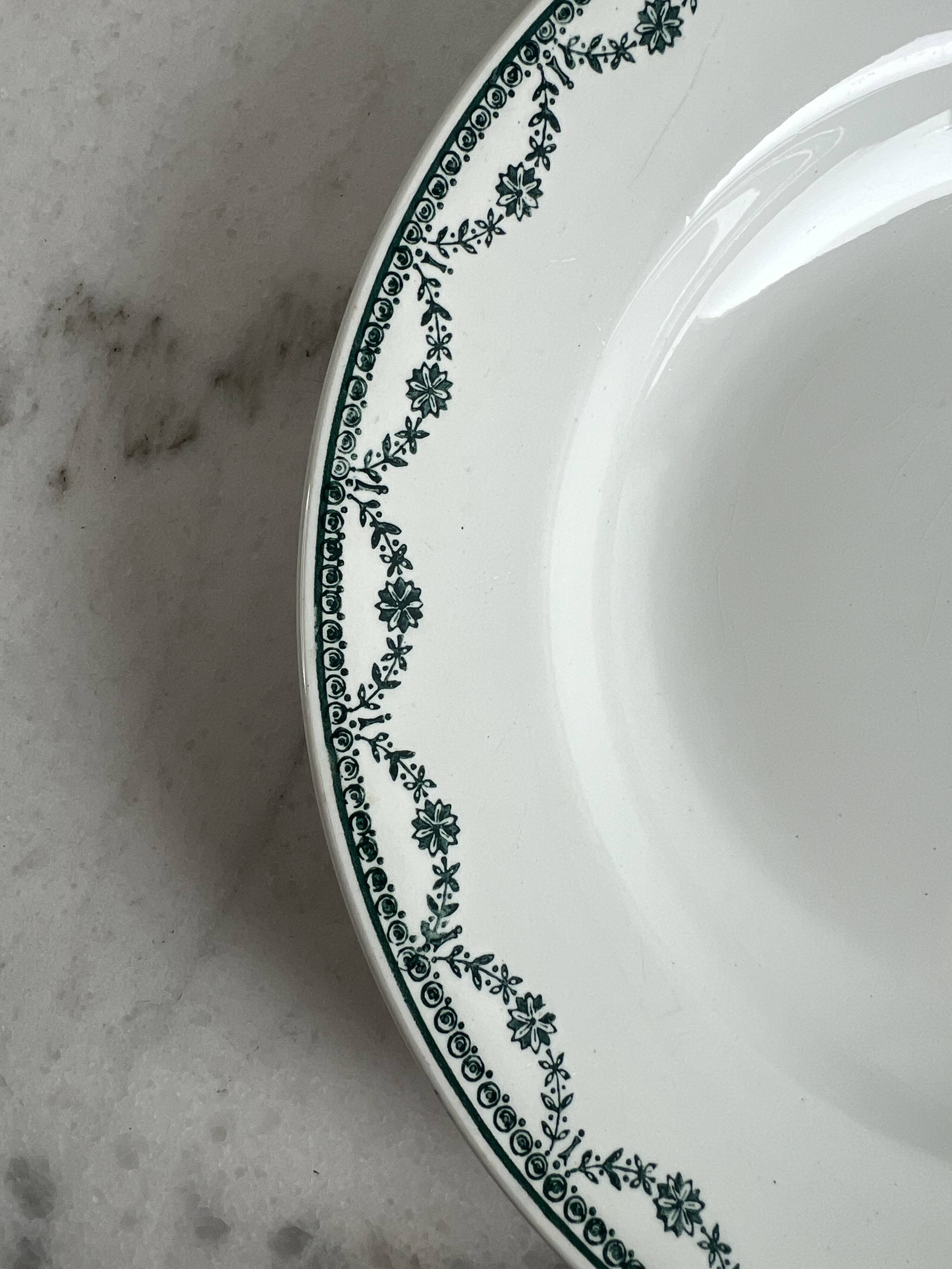 Set of two green frilled deep plates from Saint-Amand.