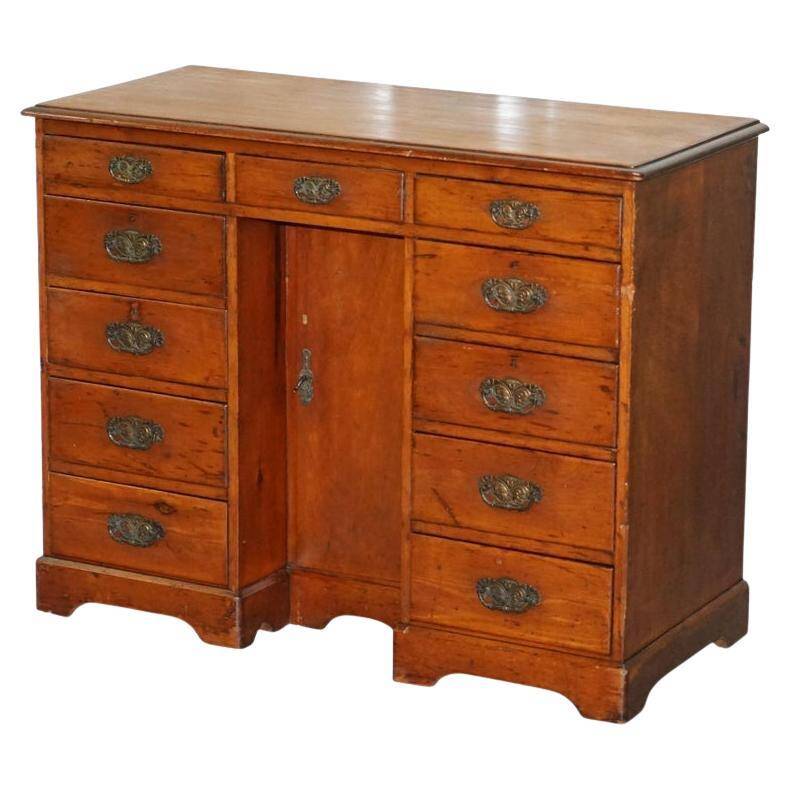 Small Victorian desk in solid walnut with drawers.