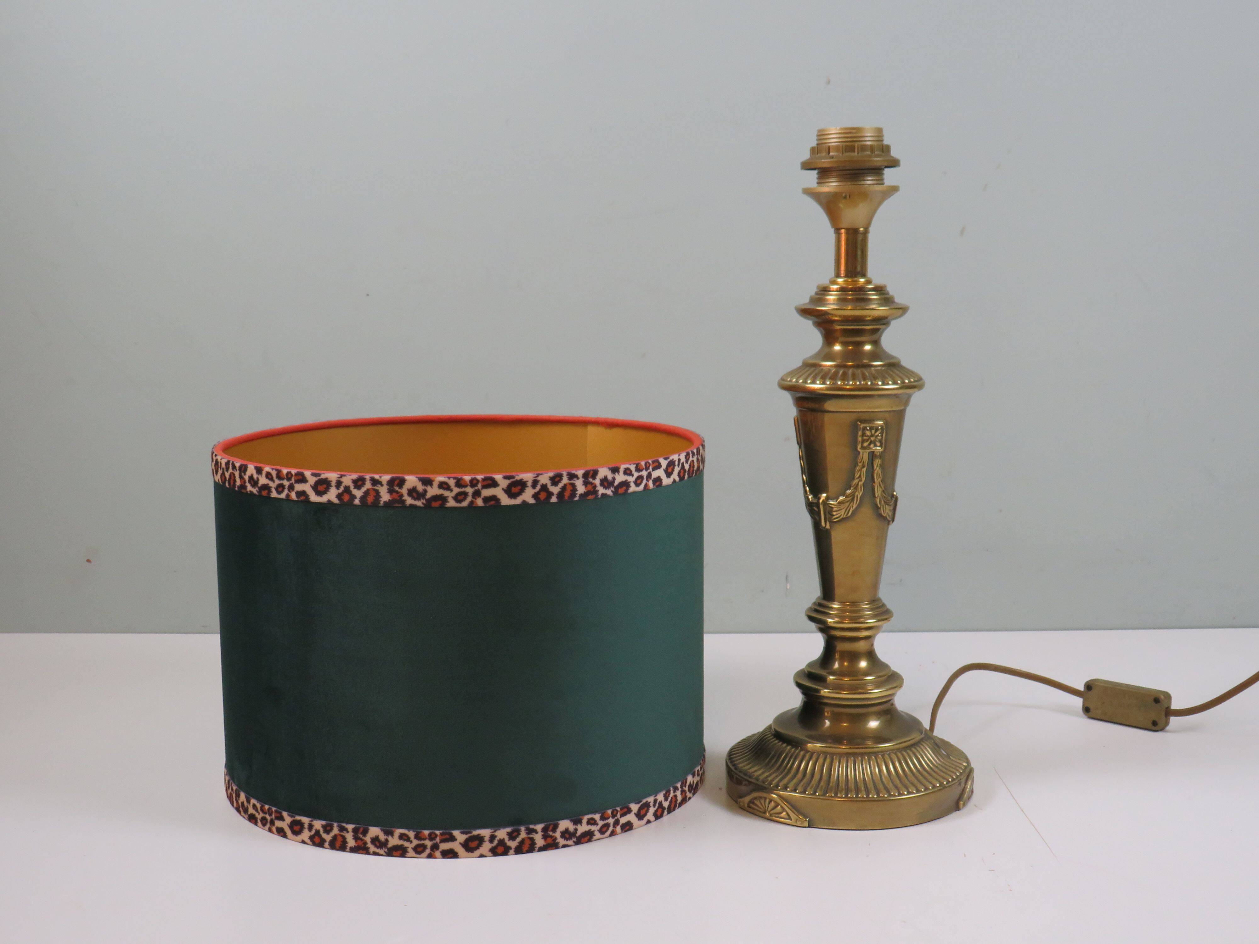 Vintage brass table lamp with green velvet shade.