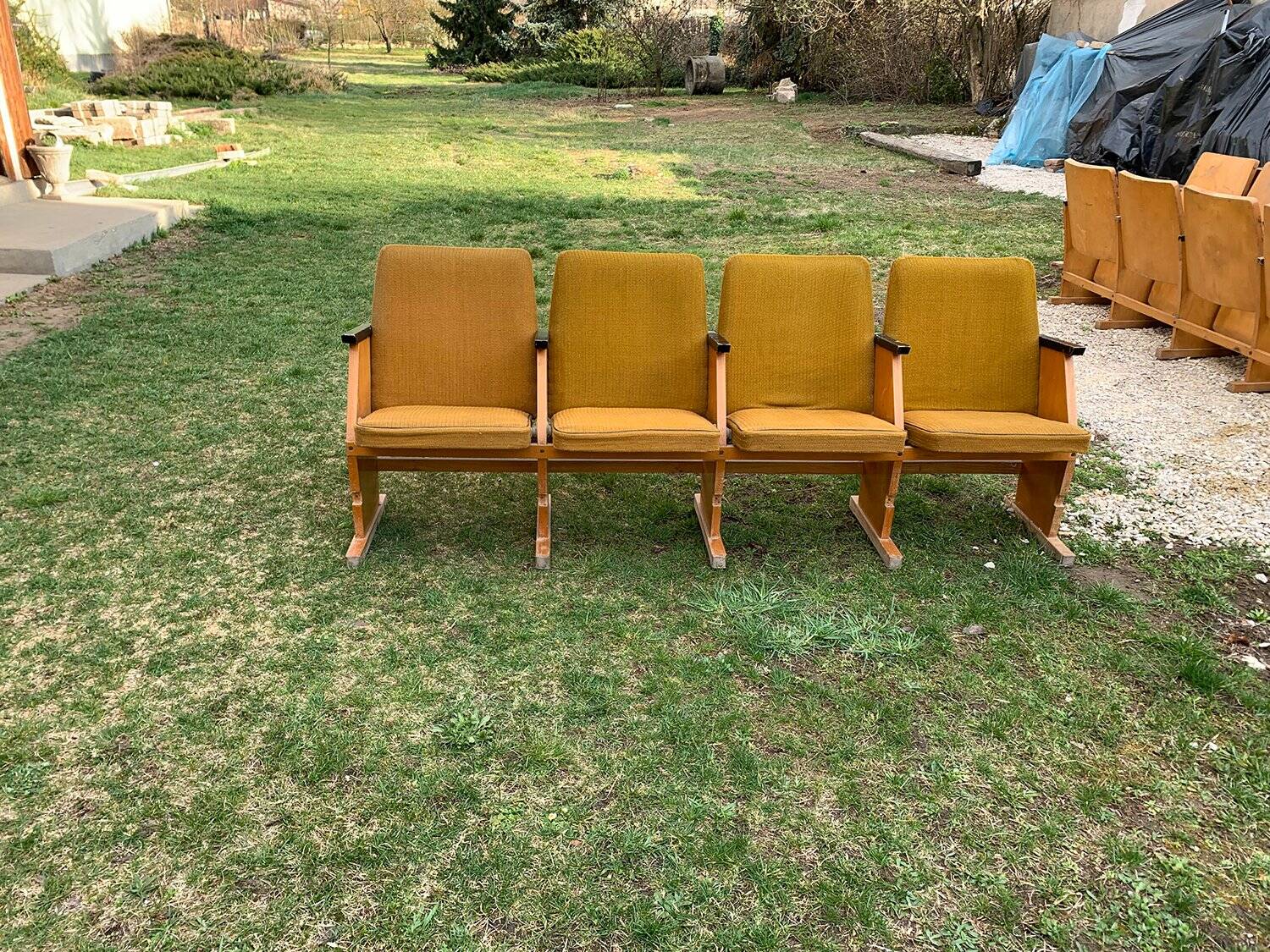 Set of 4 mid-century cinema seats in yellow fabric and light wood, 1950s.