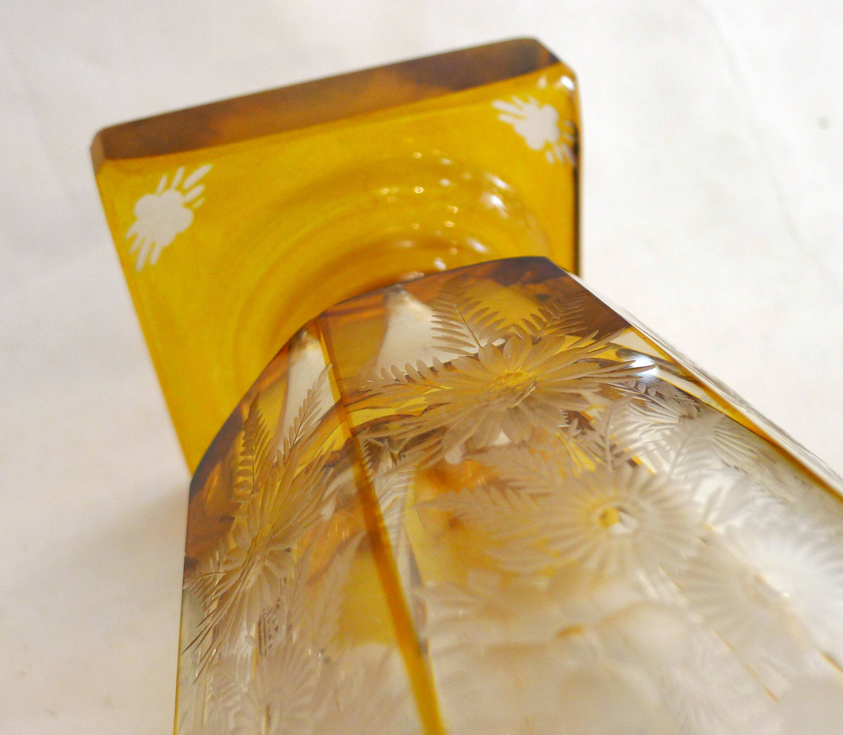 Art Deco vase engraved with flowers, faceted body on a pedestal.