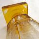 Art Deco vase engraved with flowers, faceted body on a pedestal.