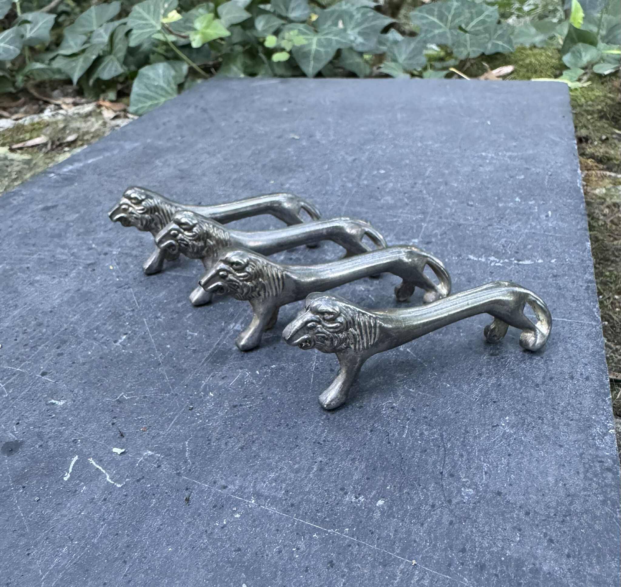 4 silver lion knife holders