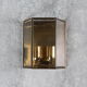 Wall sconce in brass and glass