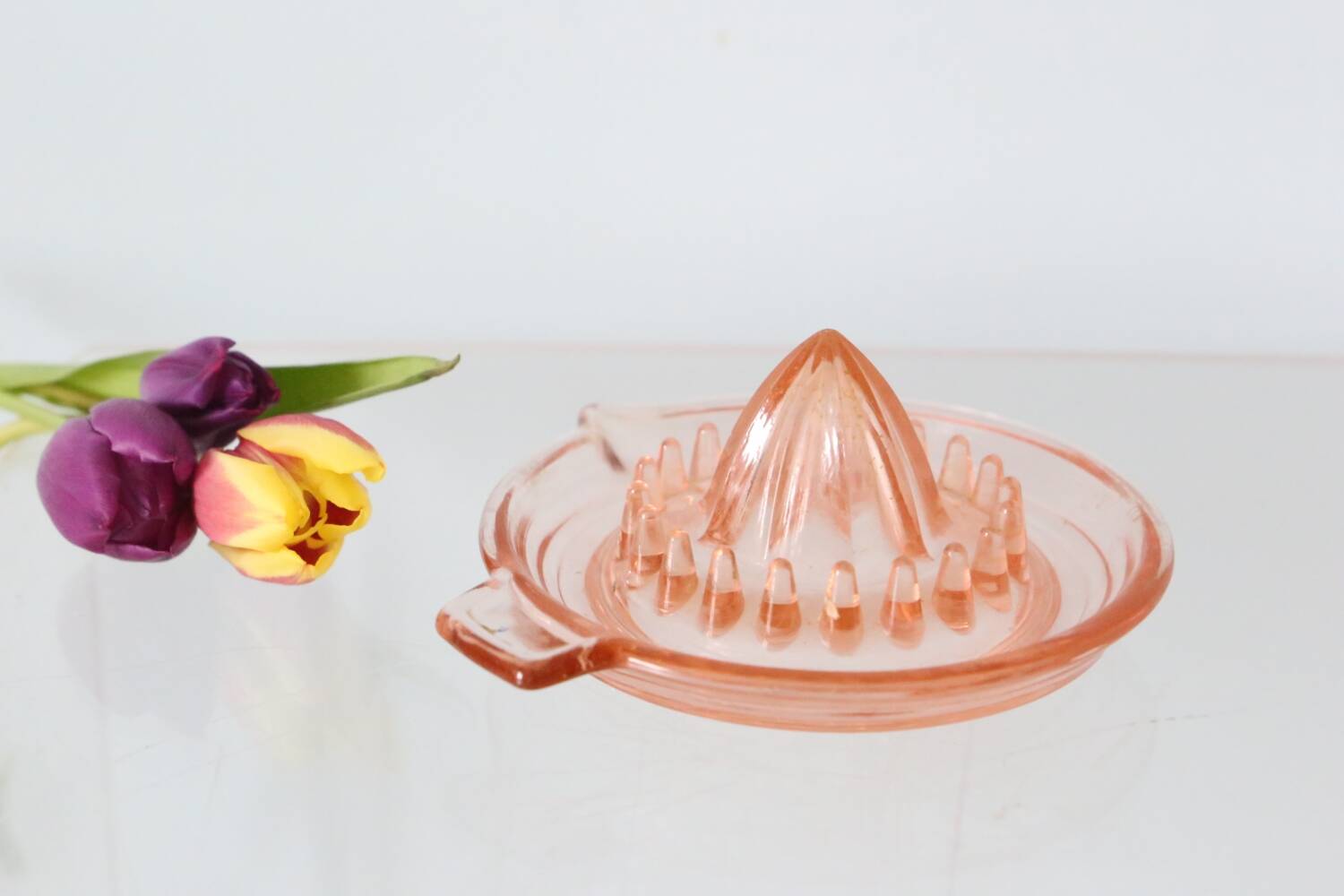 Adorable pink glass juicer