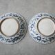 Pair of antique Chinese decorative plates with dragon motif.