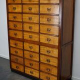 School cabinet bank of vintage Dutch drawers in mid-twentieth century pine