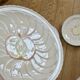 Vintage earthenware plates with a trompe l'oeil apple tart design