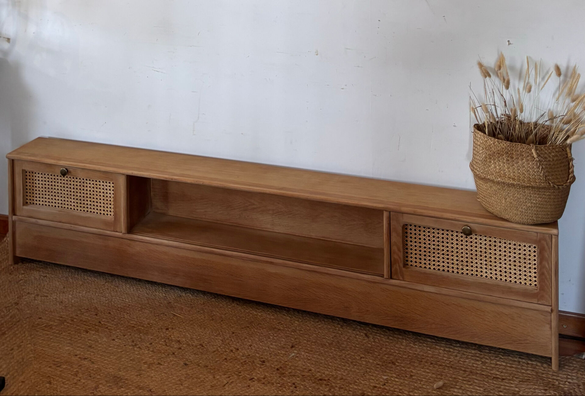 TV sideboard in raw oak and cane.