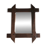 Rectangular mirror with bevelled wooden frame, 1970s.