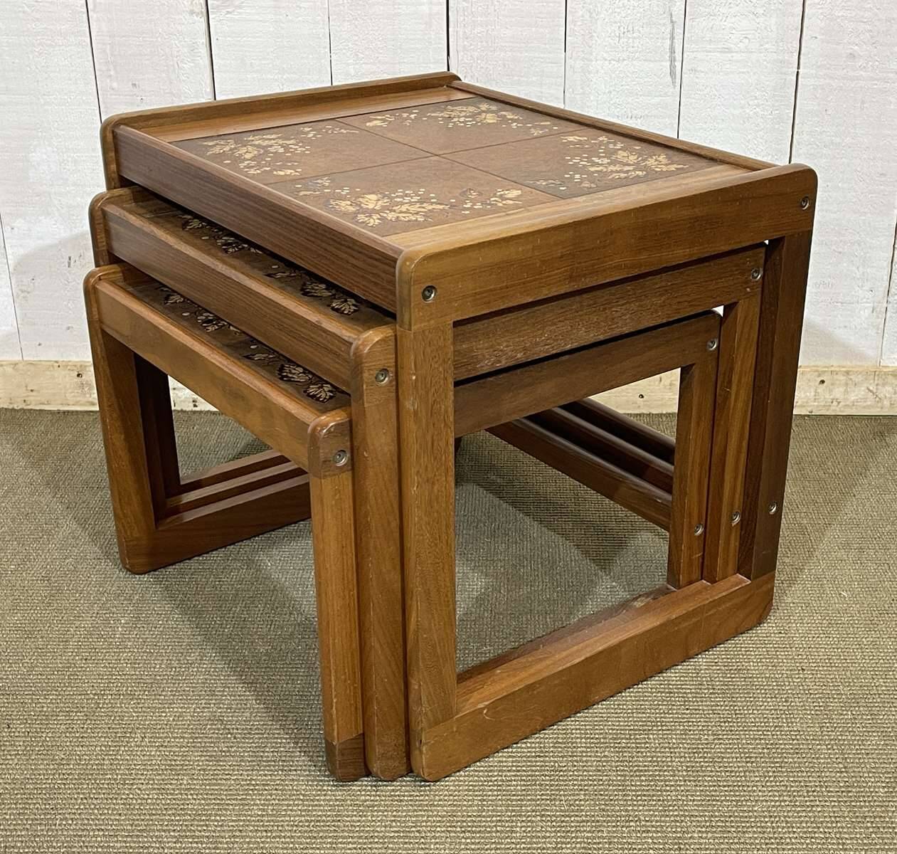 Set of 3 nesting tables in teak with tiled tops.
