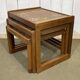 Set of 3 nesting tables in teak with tiled tops.