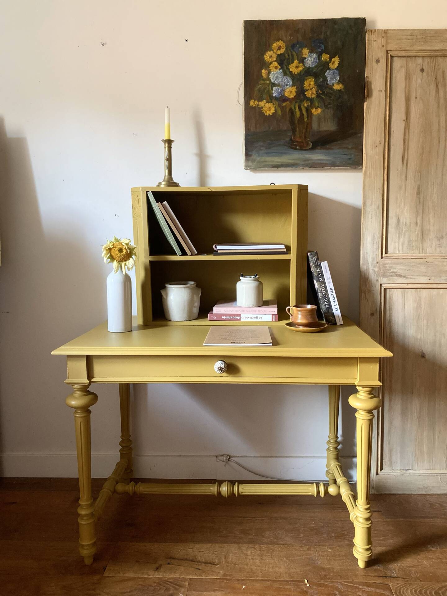 Desk table from the late 19th century, painted mustard, with turned stretcher.