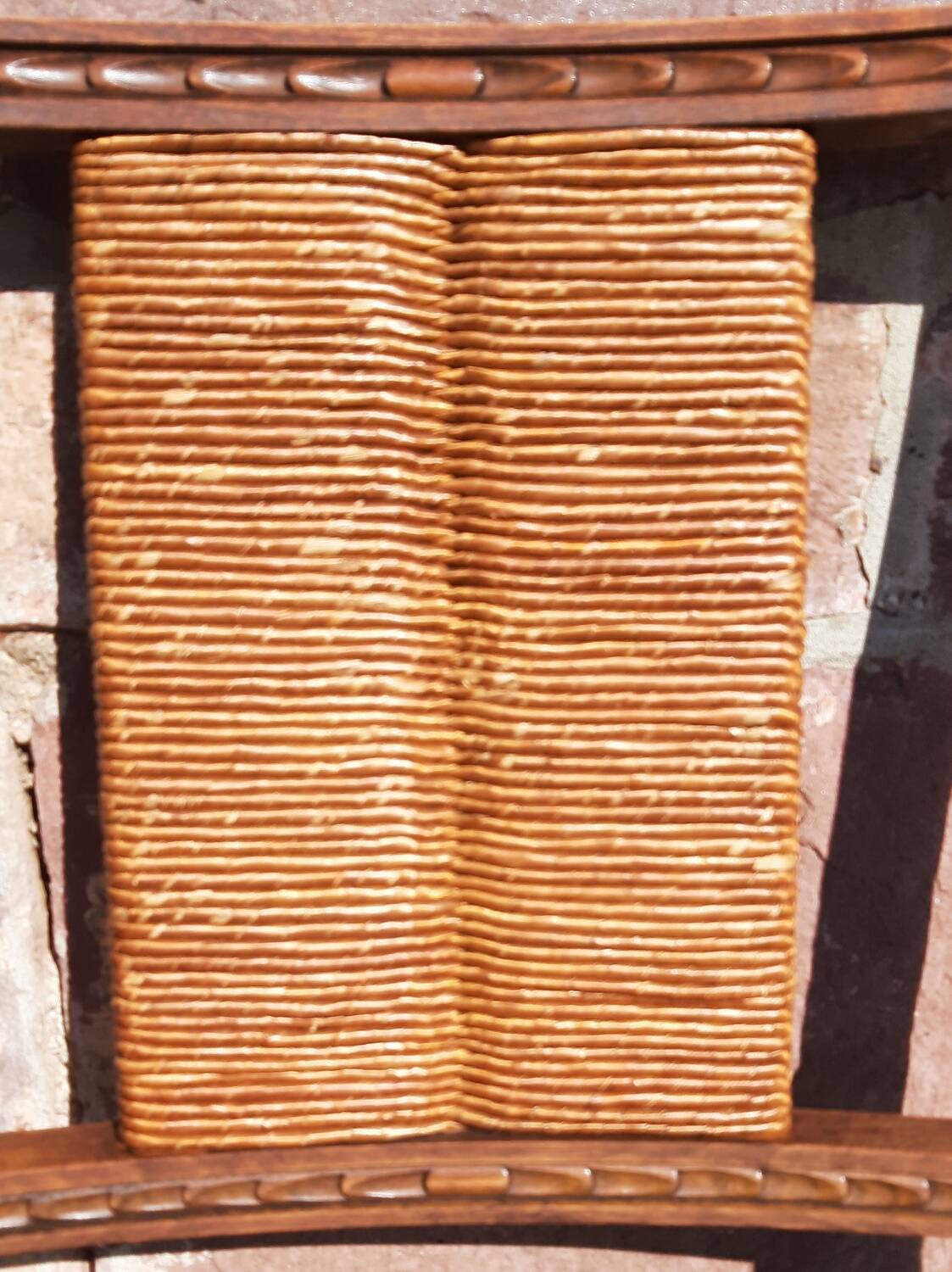 Pair of oak armchairs with straw seats and backs.