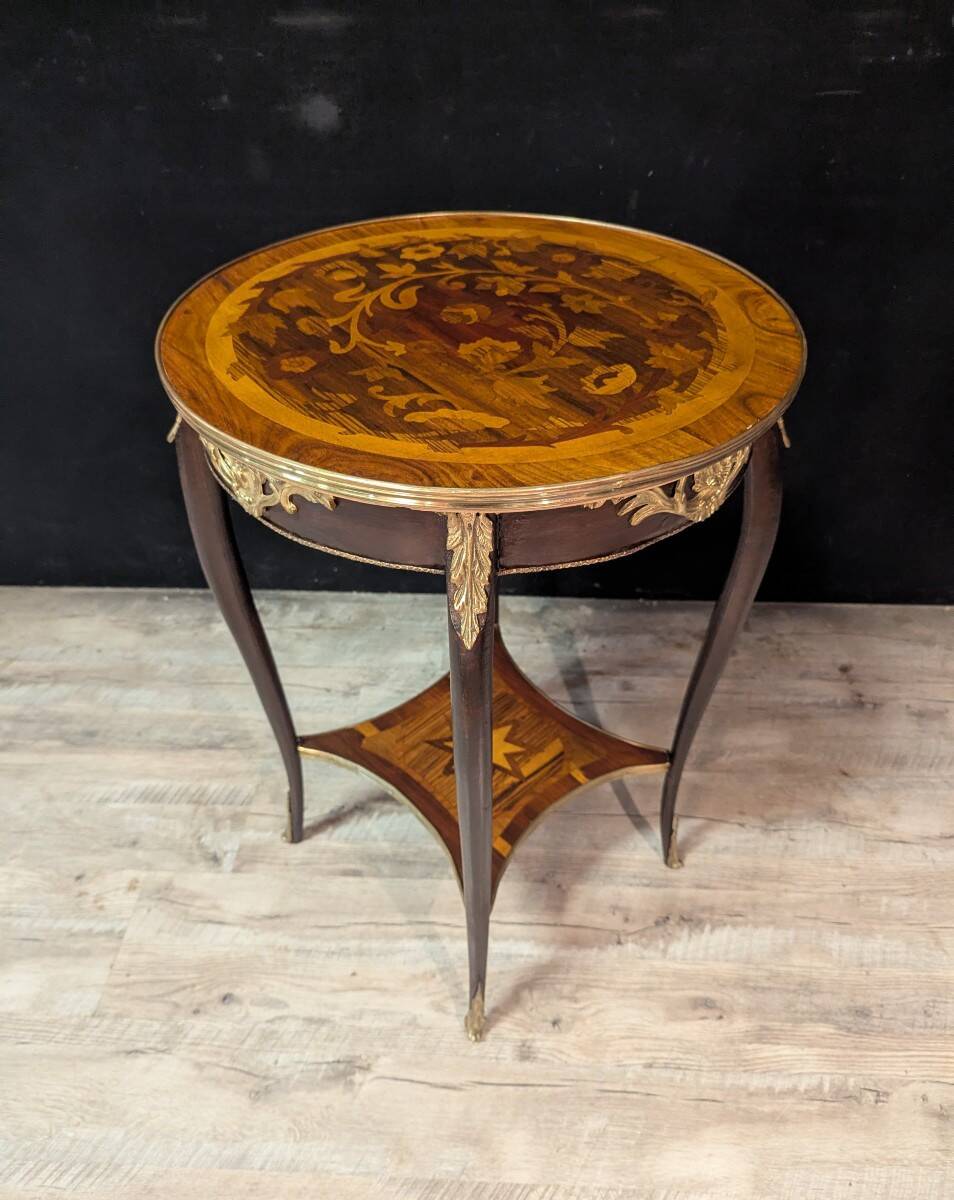 Louis XV style gueridon with floral marquetry.