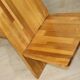 Sculptural brutalist armchair in solid elm, 1980.