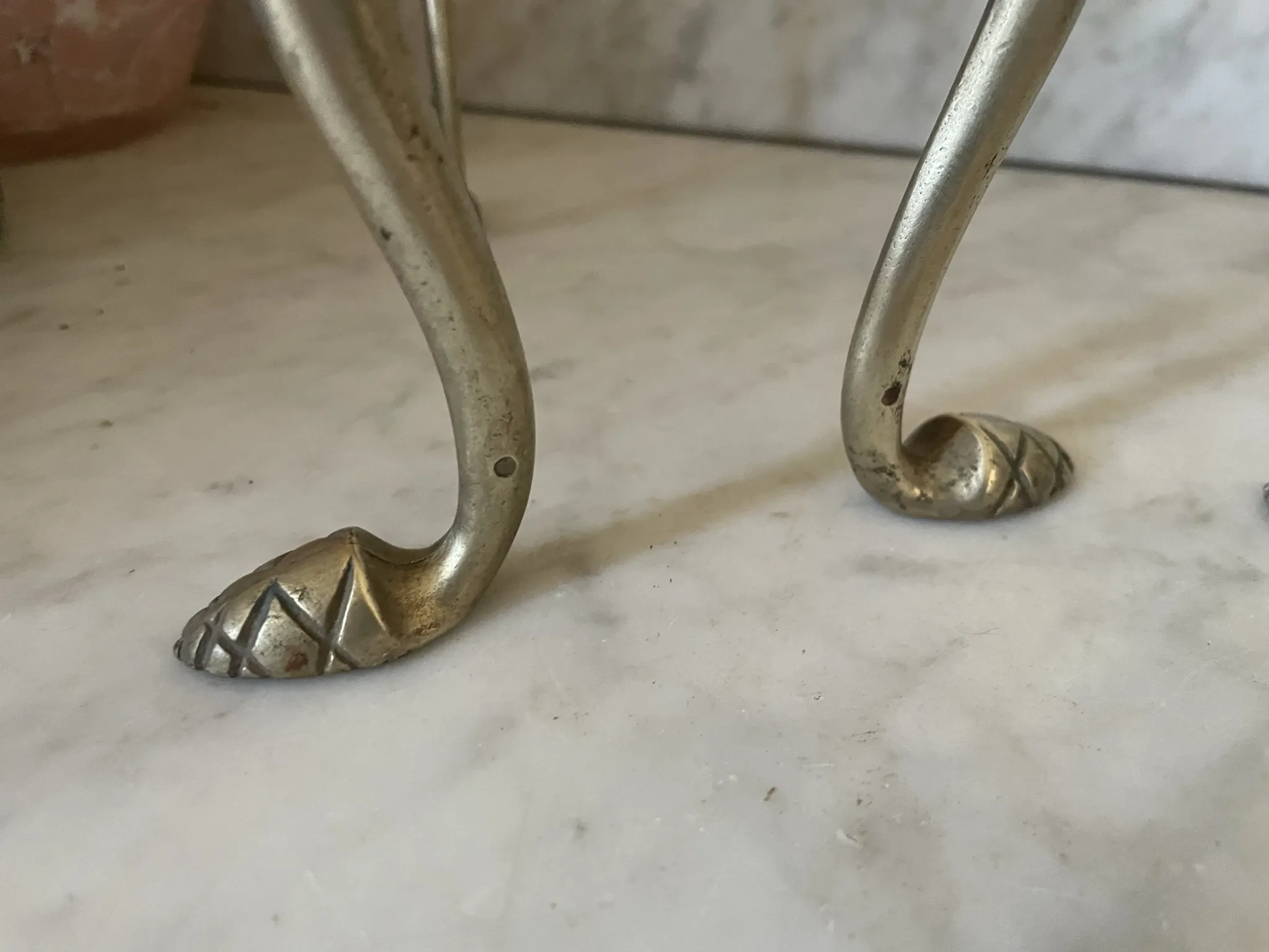 Pair of Victorian brass fire dogs from the late 19th century.