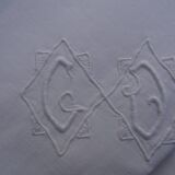 A pair of pillowcases monogrammed CD