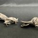 Showcase objects, two 20th century metal rooster and hen subjects