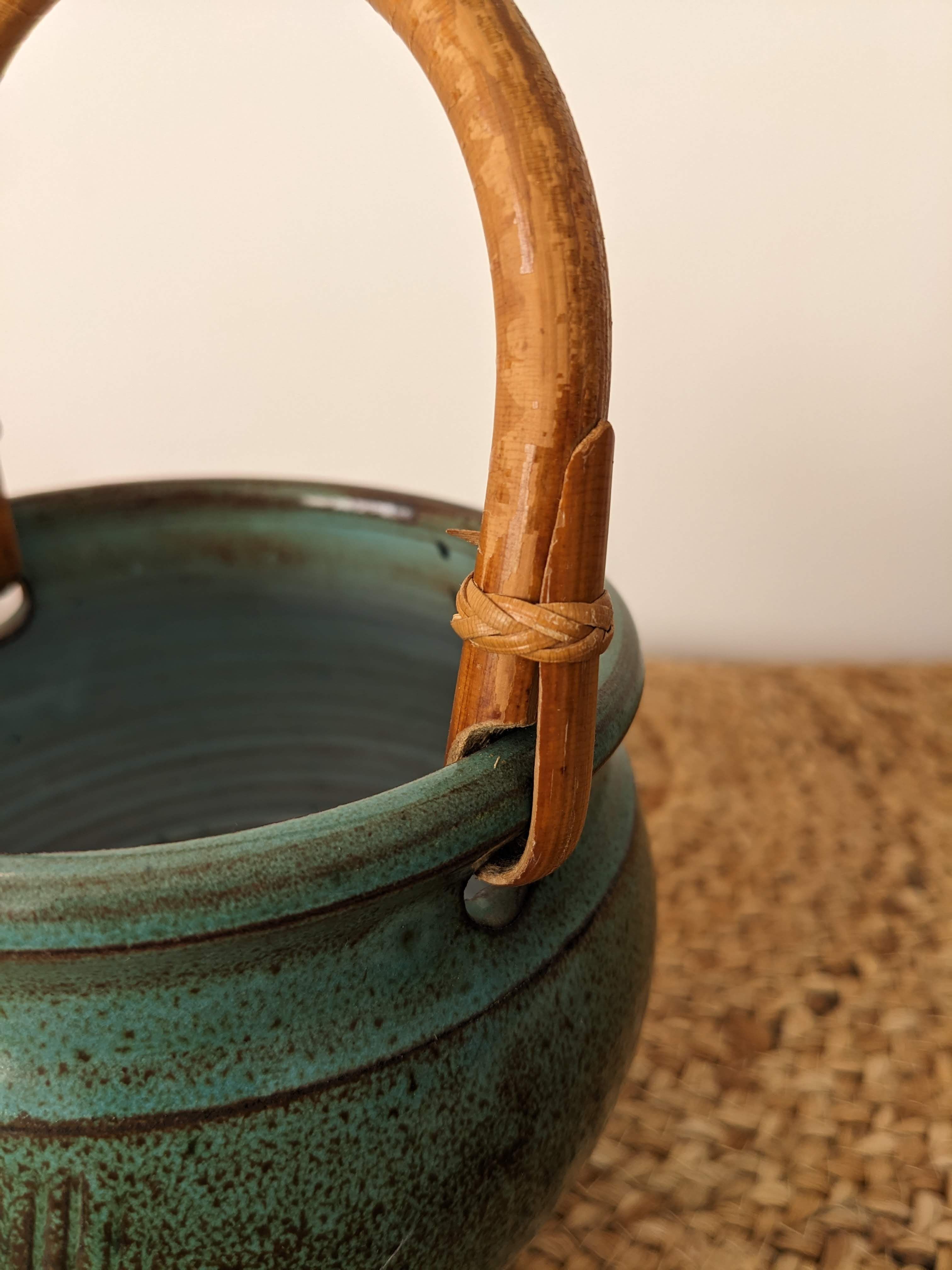 Ceramic pot with rattan handle