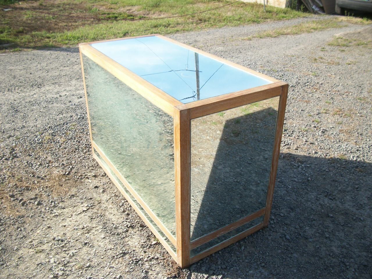 Small vintage buffet of commerce surrounded by mirrors