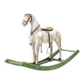 Antique wooden rocking horse, vintage toy with original patina.