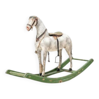 Antique wooden rocking horse, vintage toy with original patina.