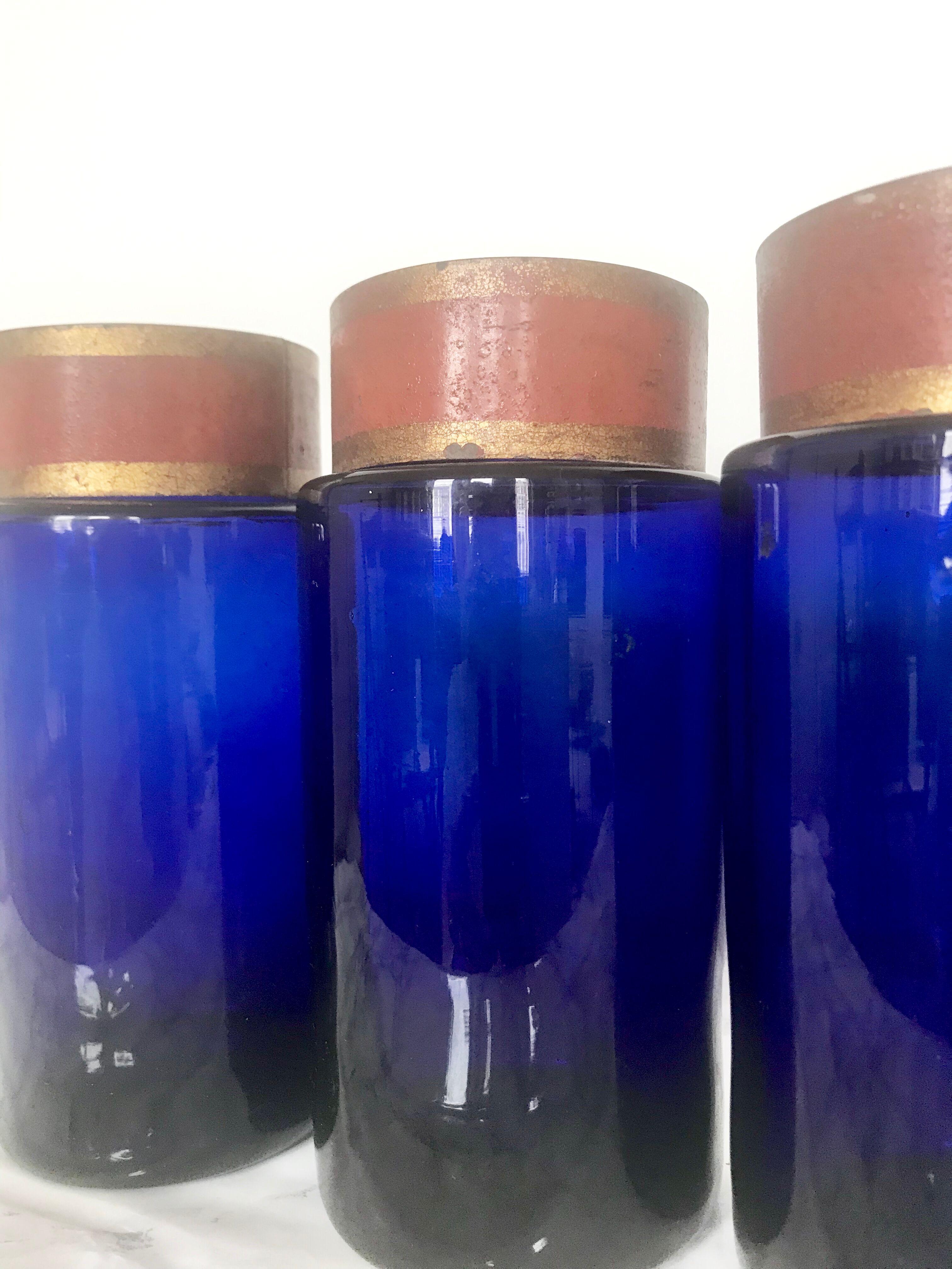 Suite of four bottles of ancient apothecary in blue breath glass