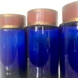 Suite of four bottles of ancient apothecary in blue breath glass