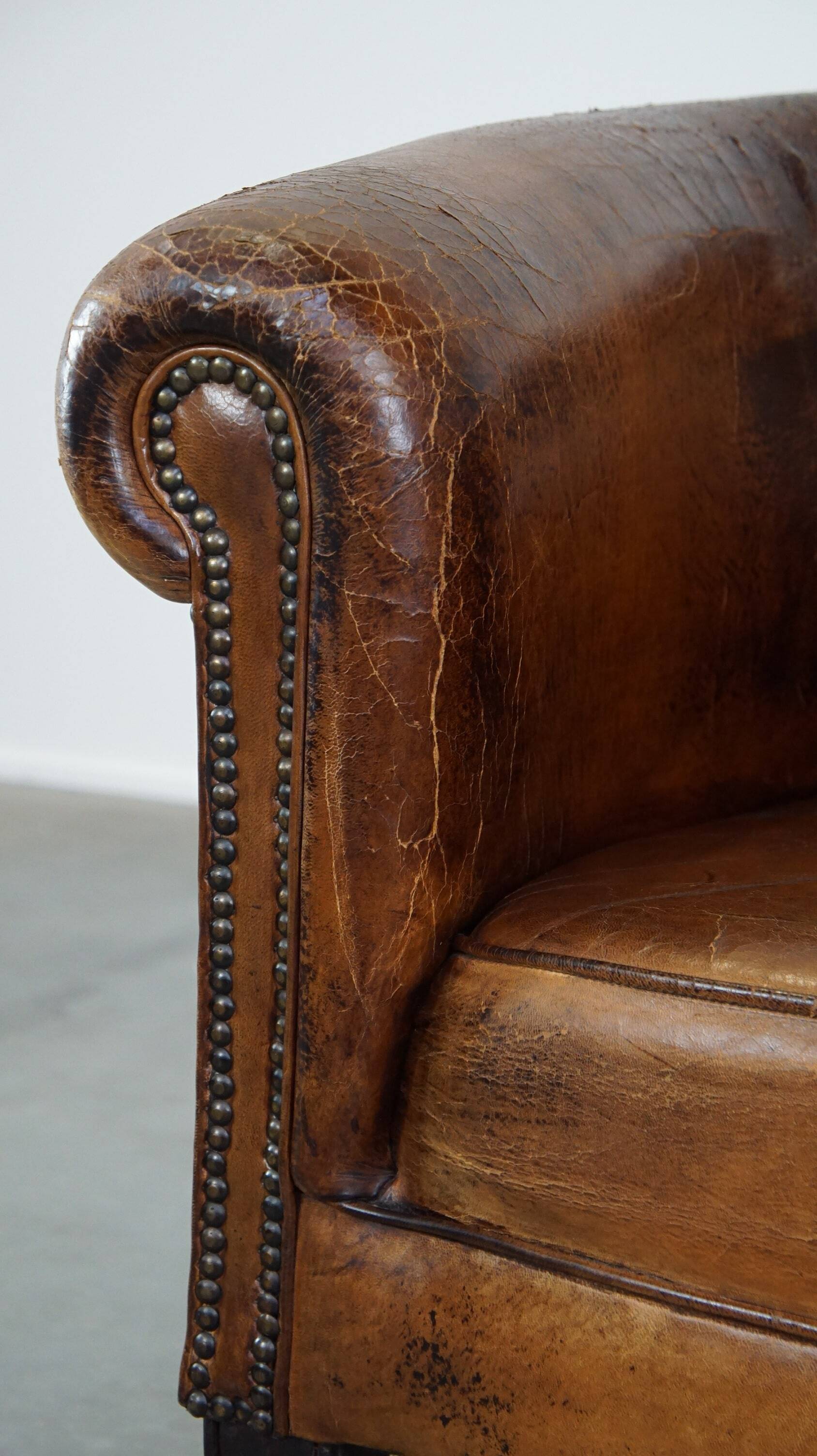 Sturdy, stately and subtle vintage sheepskin club chair