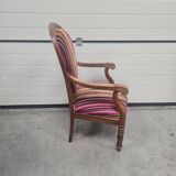 Antique armchair in multi-colored striped velvet with turned legs