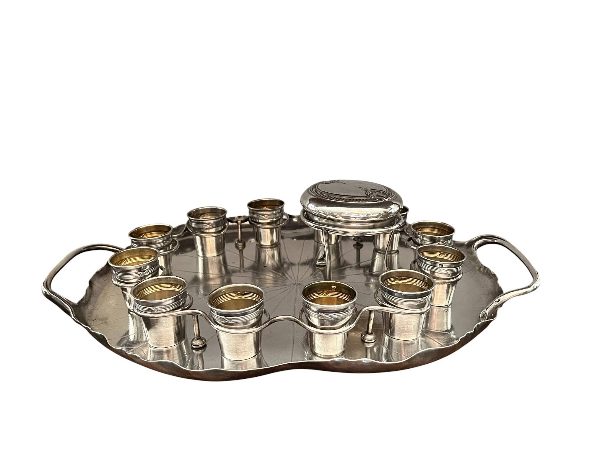 Silver-plated metal caviar service and 12 silver Minerva goblets, circa 1900