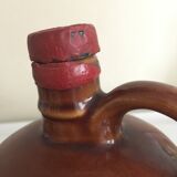 Old bottle of Calvados in sandstone