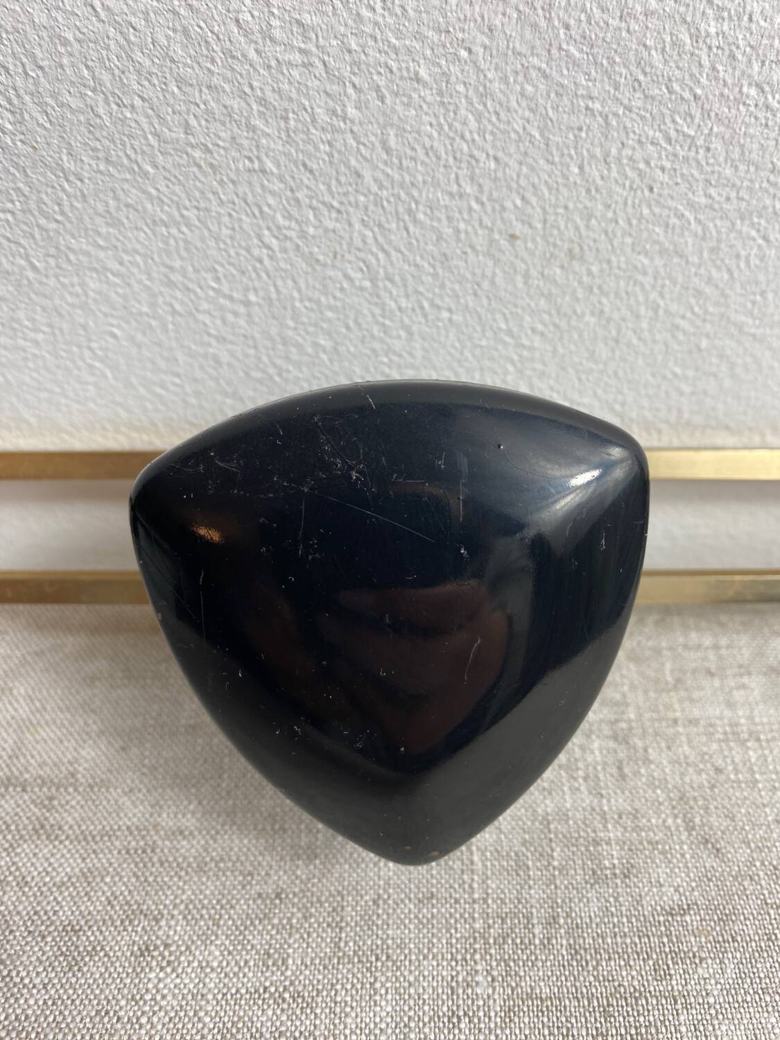 Wall-mounted coat rack with 3 hooks from the 1960s.