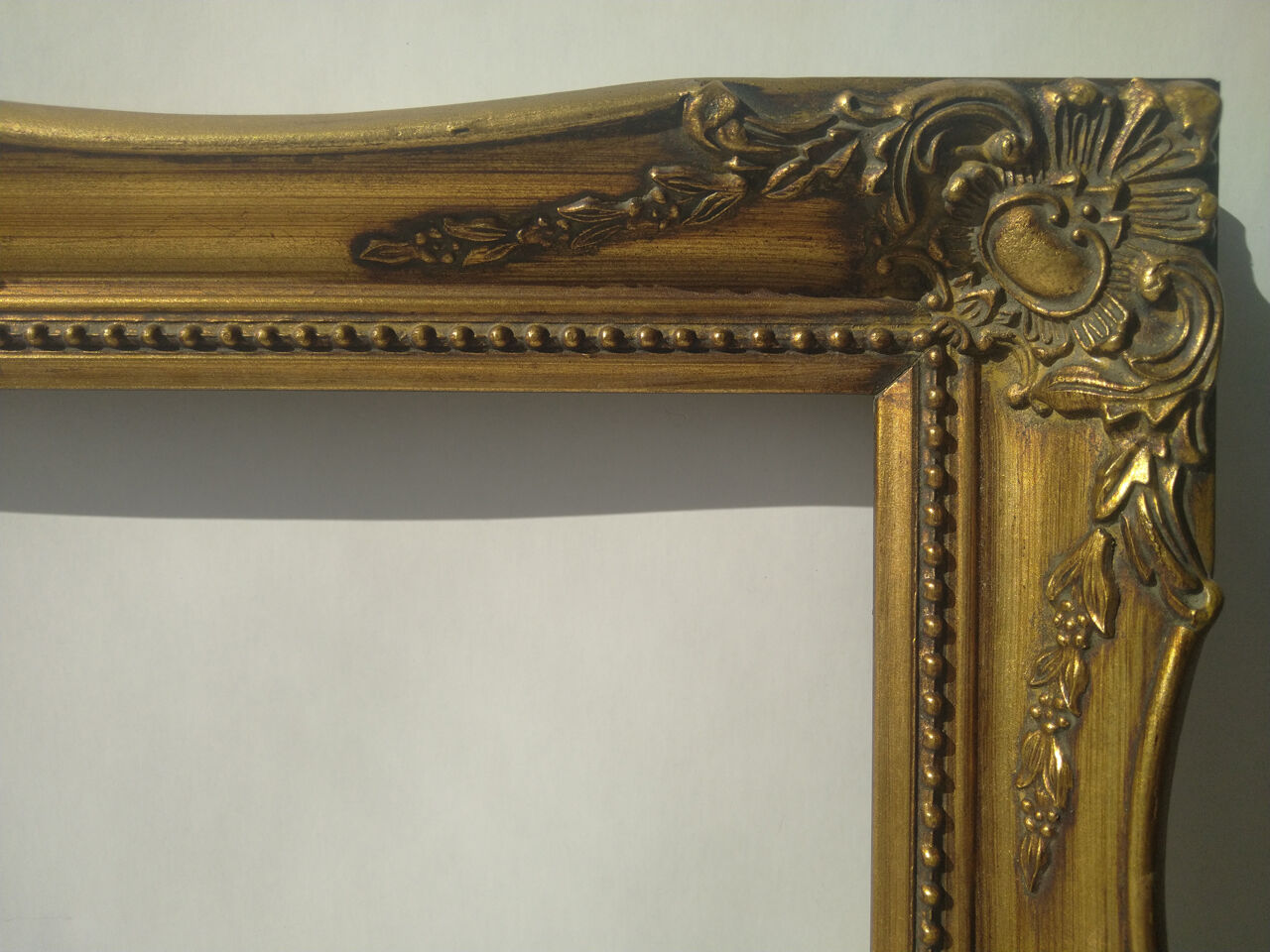 Golden sculpted frame for photo or artwork