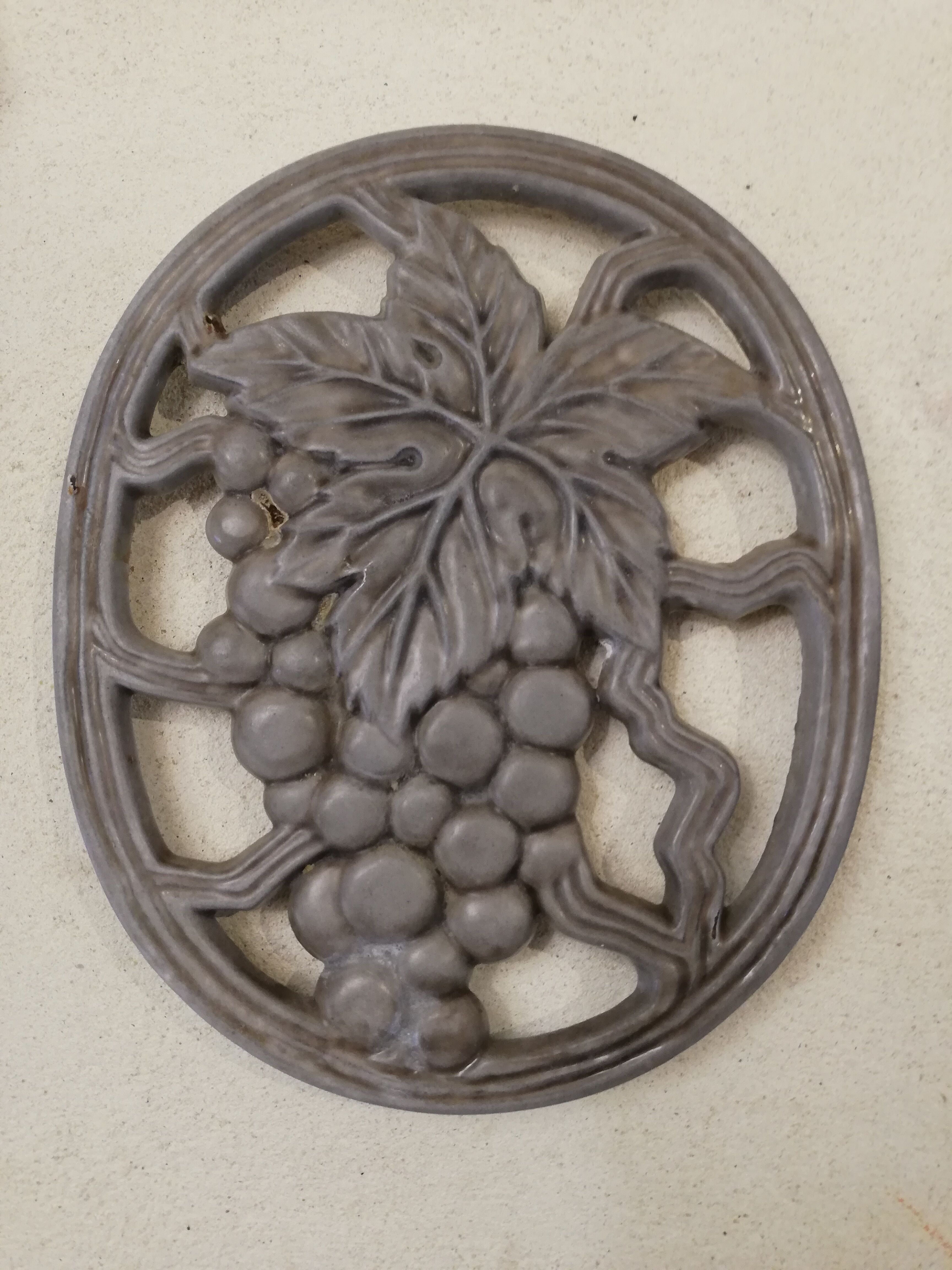Cast iron underside bunch of grapes