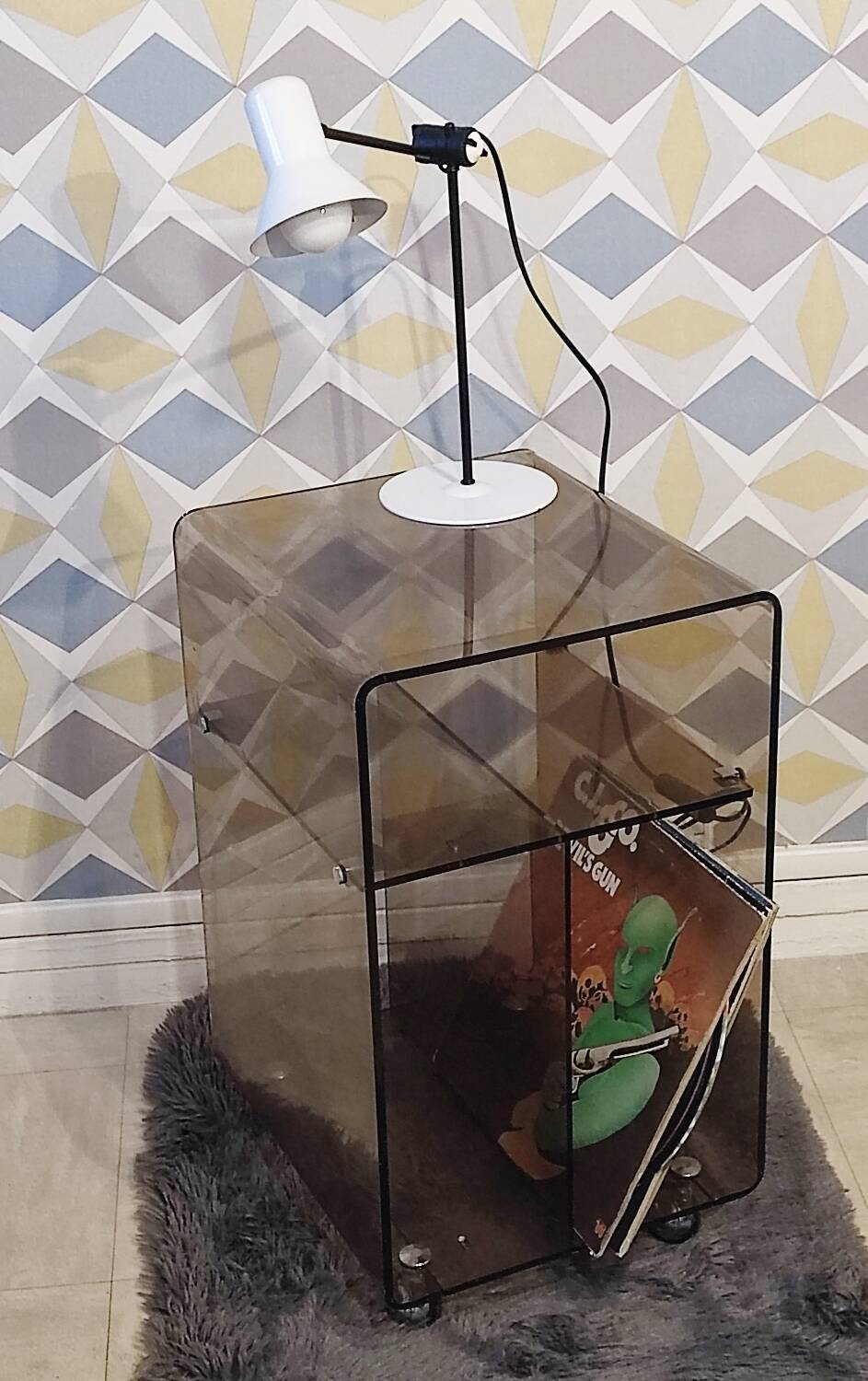 Michel Dumas smoked Plexiglas rolling table.