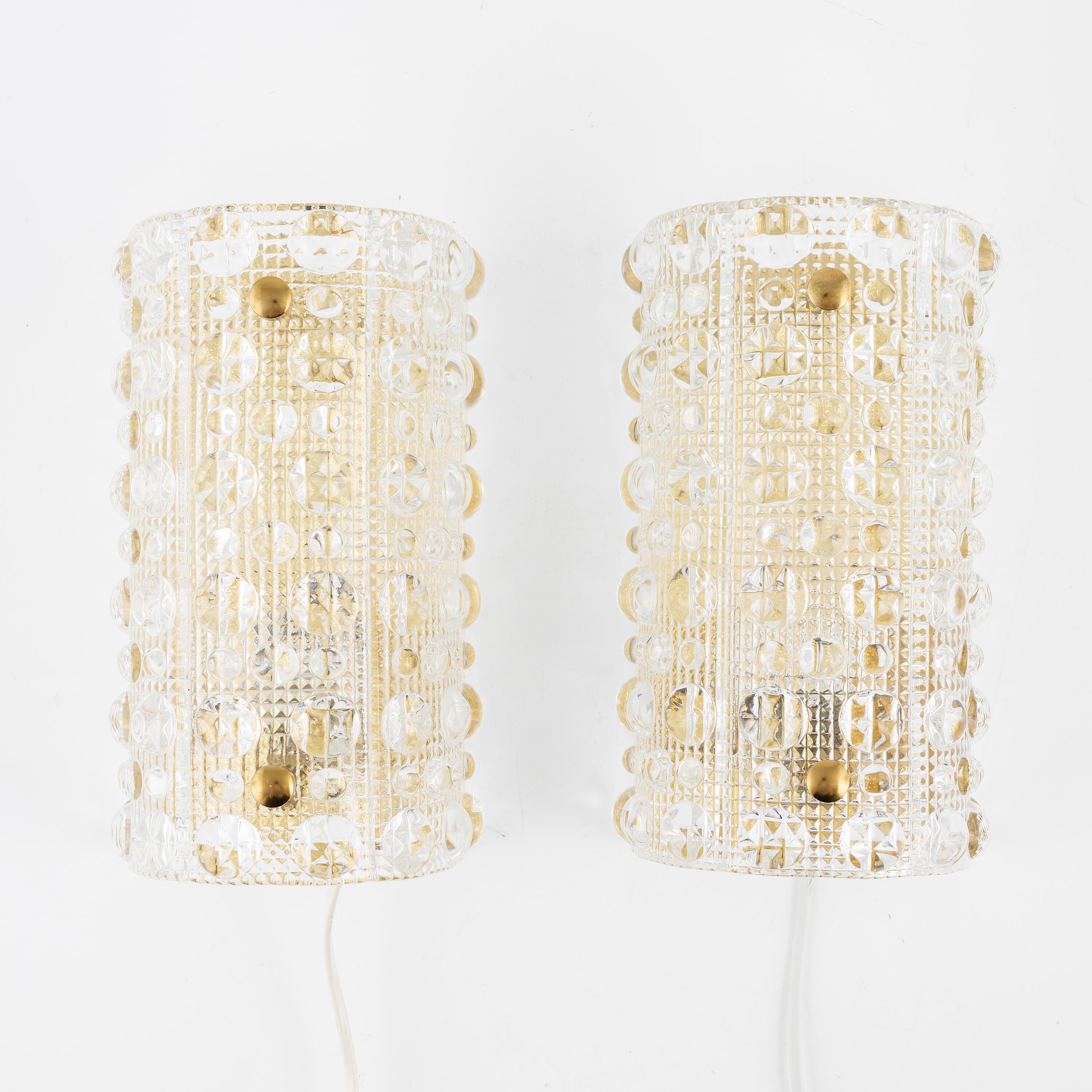 Carl Fagerlund, pair of glass wall lights for Lyfa, Orrefors Sweden, 1960.
