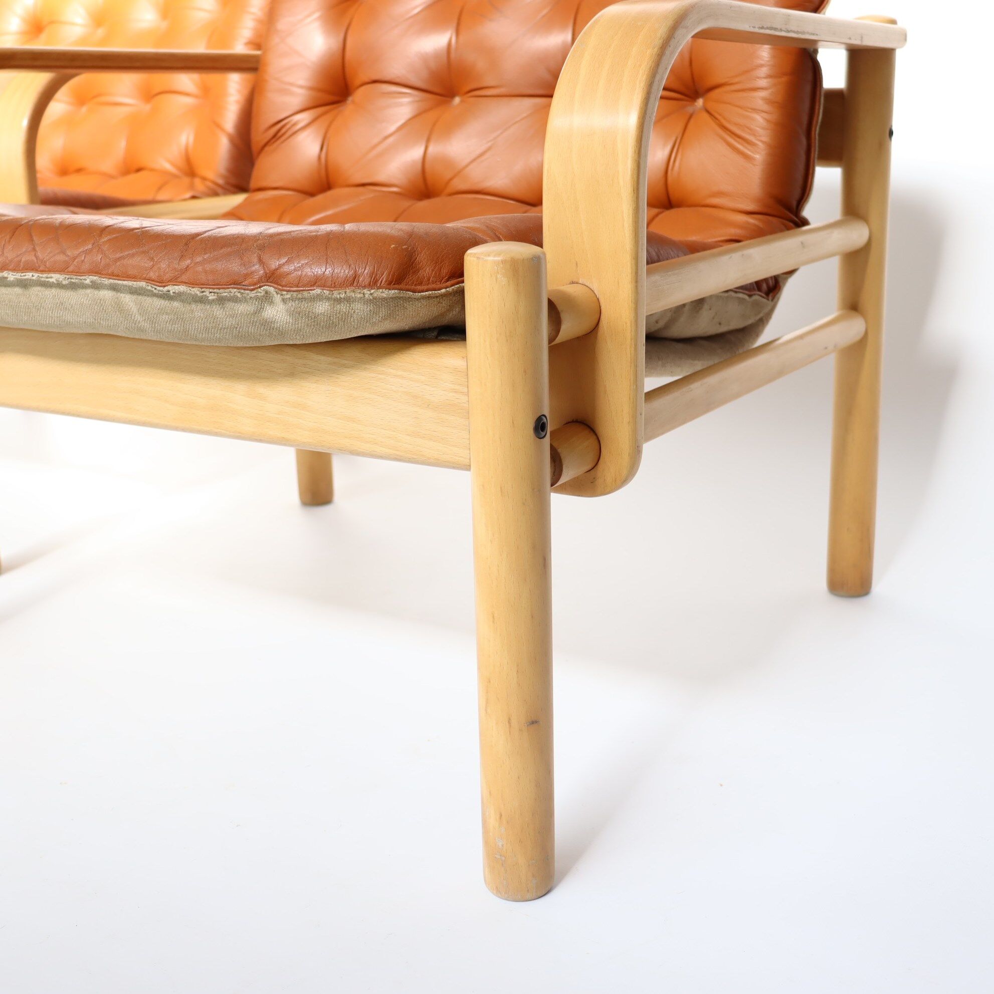 Upholstered leather armchairs 70s