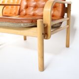 Upholstered leather armchairs 70s