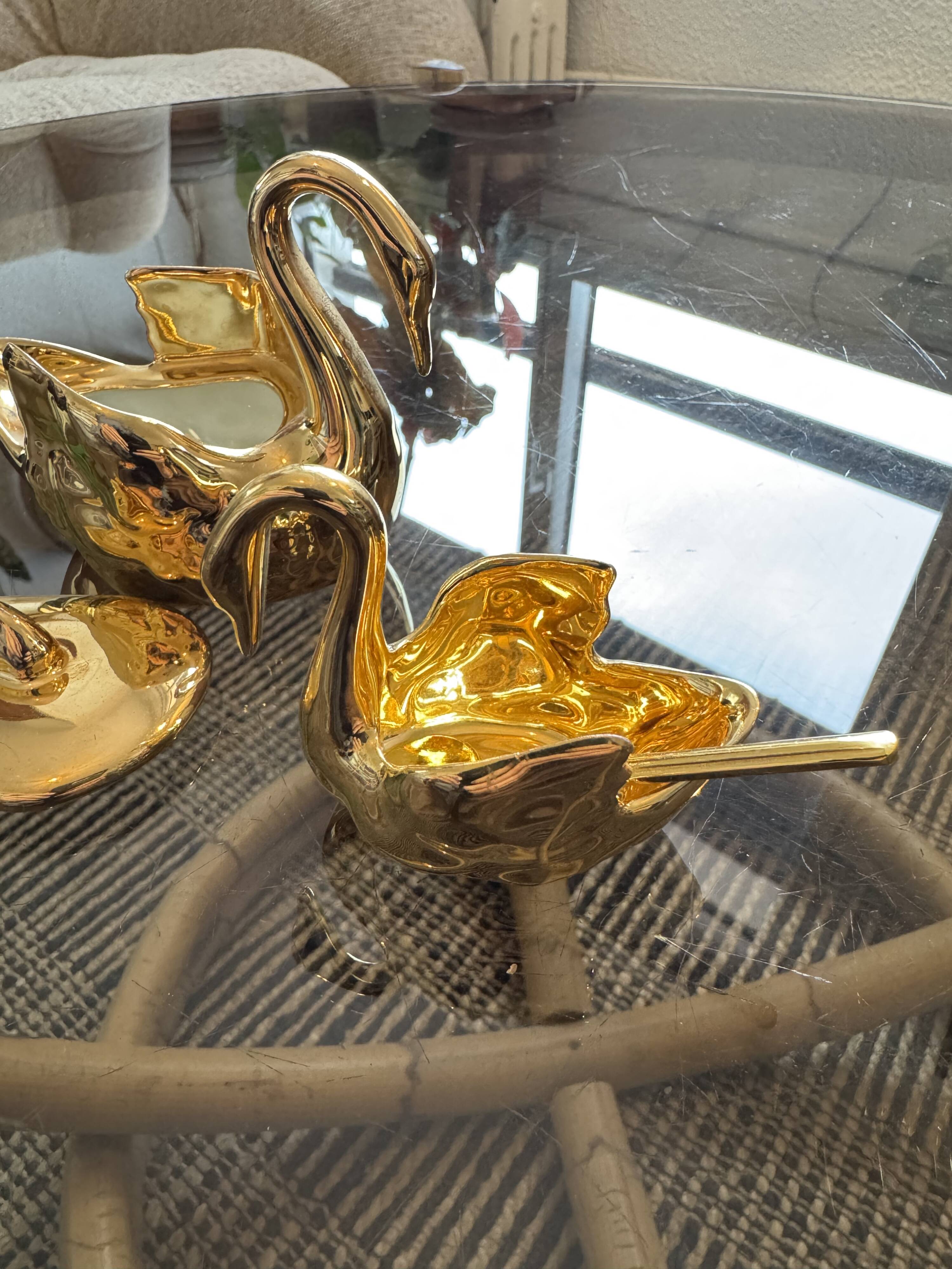 Pair of golden salt cellars in Limoges porcelain shaped like swans